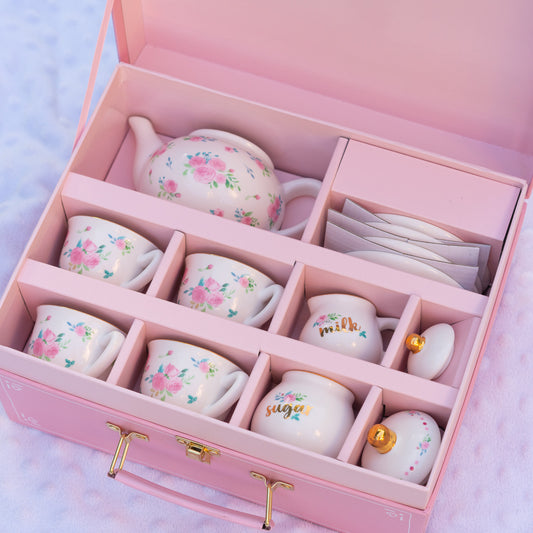 13-piece porcelain tea party set with teapot, 4 cups, saucers, sugar bowl and milk pot in a carrying case