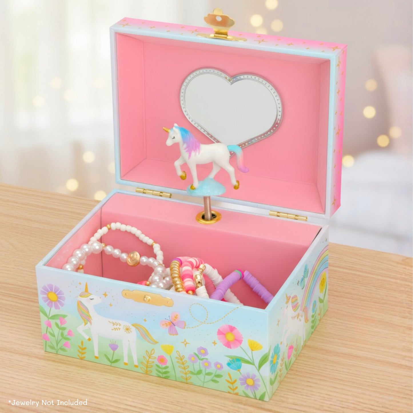 unicorn jewelry box with unicorn design on a wooden surface