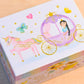 Children's jewelry box with princess and unicorn design on a wooden surface