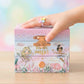 Children's jewelry box with fairy design and 'You are magic!' text, held by a child's hand.