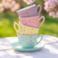 Pastel gold dot porcelain tea set contents: teapot, sugar bowl, milk pot, and four pastel teacups with saucers