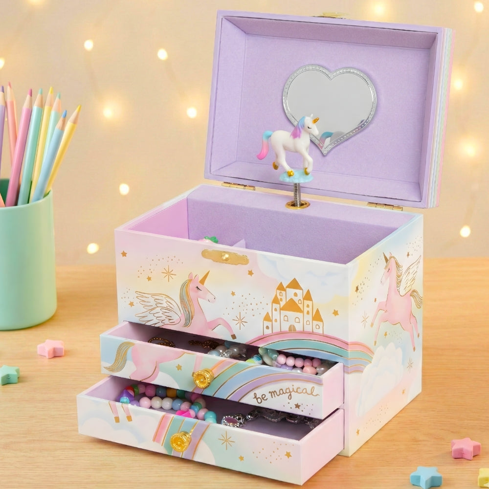 Unicorn-themed jewelry box with pastel colors on a wooden surface.
